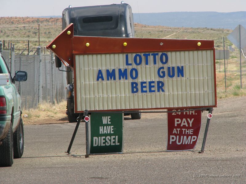 IMG_1884.JPG - Entering Utah, value systems seem to change. But agreed, these ads at the gas station at least mention Pumps and Diesel...